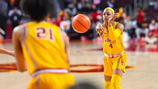 Kayla Williams passes to Dominique Darius in a game at Galen Center