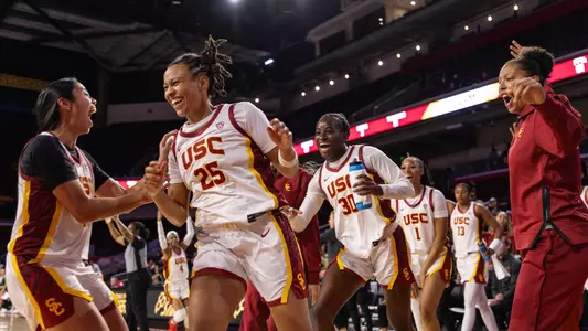 McKenzie Forbes and teammates celebrate at Galen Center