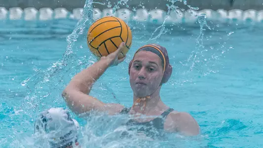 Bayley Weber winds up for a pass in a rainy scrimmage at Uytengsu Aquatics Center.