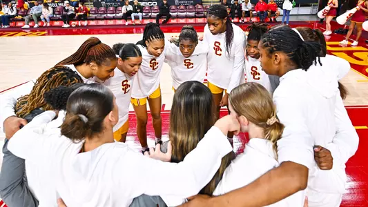 USC players gather in a pregame team huddle at Galen Center