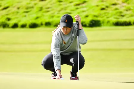 Malia Nam preparing for a putt