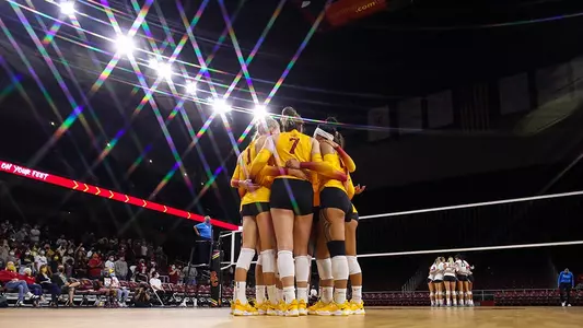 Team huddle at Galen Center