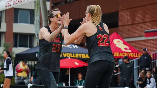 Delaynie Maple high fives with Megan Kraft