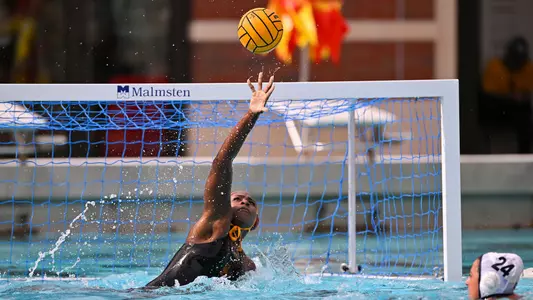Goalie Jada Ward stretches for a save vs. UC Irvine at Uytengsu Aquatics Center