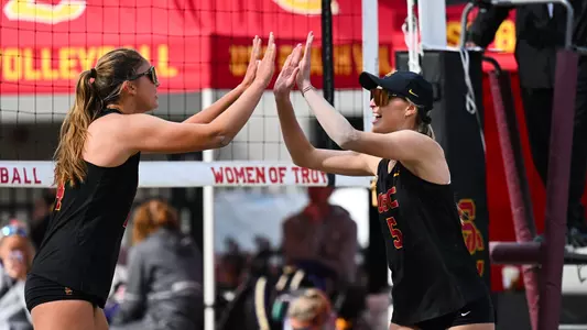 Bailey Showalter and Olivia Bakos high five