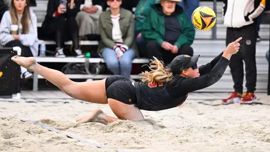 Madison Shields dives to dig a ball