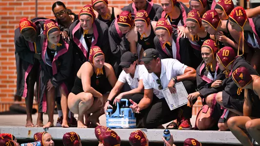 Marko Pintaric talks to the team at the side of the pool during a game at Uytengsu Aquatics Center