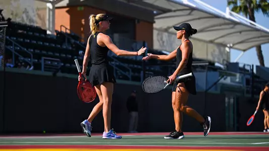 Eryn Cayetano and Maddy Sieg high-five