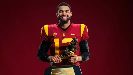 USC Trojans Football quarterback Caleb Williams with Heisman Trophy