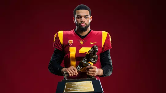 USC Trojans Football quarterback Caleb Williams with Heisman Trophy