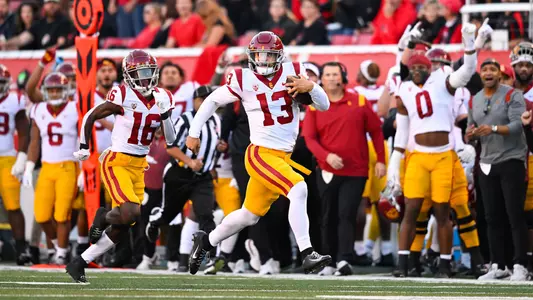 USC Trojans Football quarterback Caleb Williams runs the ball