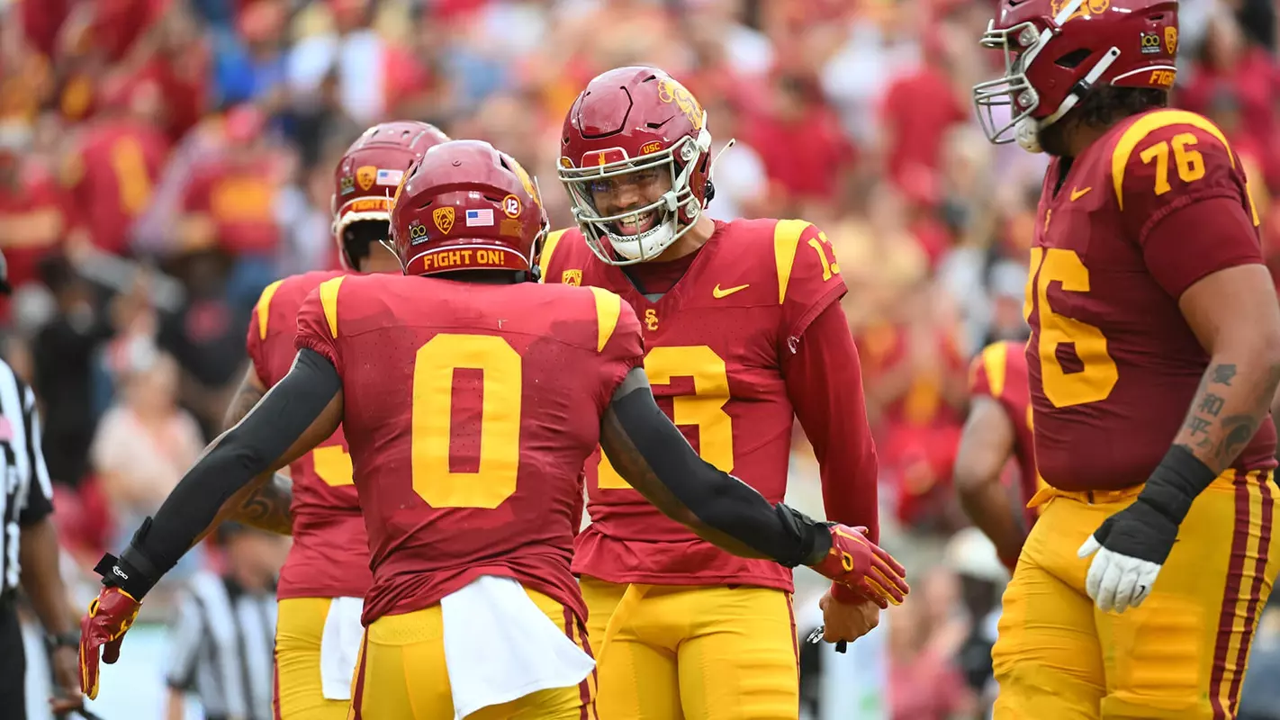 USC Trojans Football quarterback Caleb Williams celebrates with MarShawn Lloyd