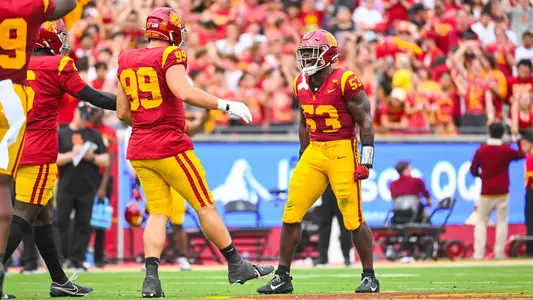 USC Trojans Football linebacker Shane Lee celebrates with defensive lineman Jack Sullivan