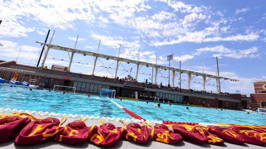 Caps are lined up poolside before a game at Uytengsu Aquatics Center