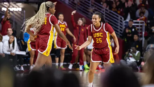McKenzie Forbes and Clarice Akunwafo celebrate a score in USC's win over UCLA at Galen Center