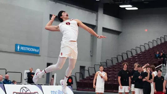 Kyle Paulson serves the ball