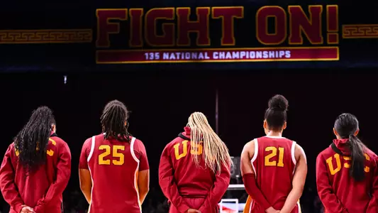 USC players line up for the National Anthem at Galen Center