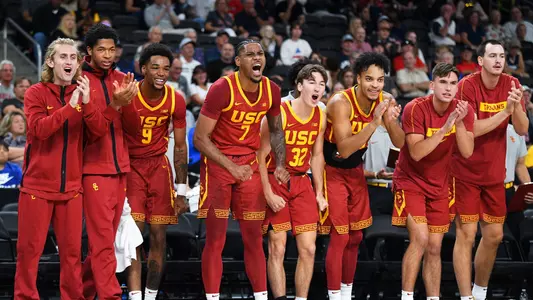 USC men's basketball celebrates on bench