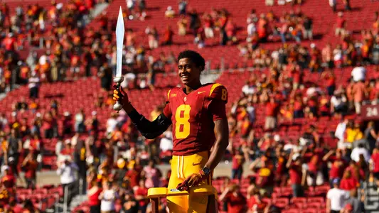 USC Trojans Football wide receiver Ja'Kobi Lane leads marching band with sword