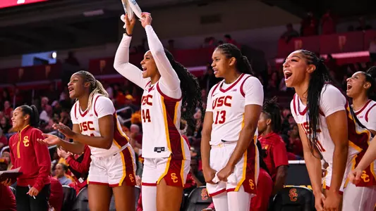 Bench celebrates during a USC win at Galen Center