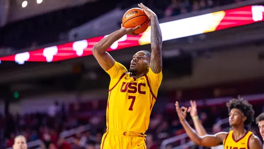 CHIBUZO AGBO PUTS UP A SHOT FROM BEYOND THE ARC