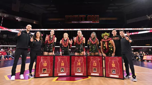 USC's senior class of Grae Gosnell, Ally Batenhorst, Mia Tuaniga, Tyrah Ariail, and Lindsey Miller are honored on senior night in front of the net at Galen Center.