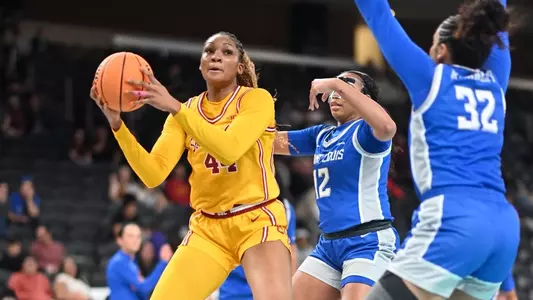 Kiki Iriafen gets ready to make a move with the ball vs. Saint Louis