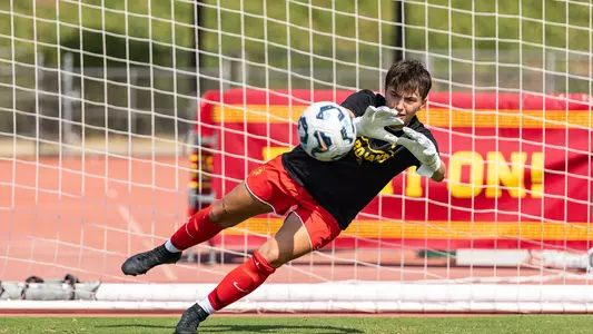 Laurence Gladu makes a diving save in goal while warming up before a game at Pepperdine University.