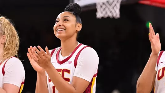 JuJu Watkins claps on court before USC's game vs. Michigan at Galen Center
