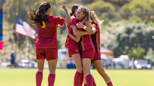 Hannah Griffin and the USC Women's Soccer team celebrate a goal at Pepperdine in a 3-1 win for the Trojans.