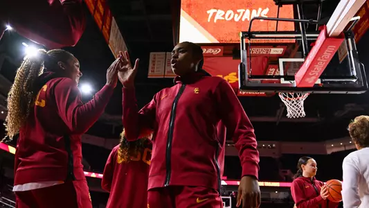 Rayah Marshall and Kiki Iriafen share a pregame five at Galen Center