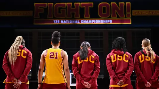 USC players stand for the national anthem at Galen Center