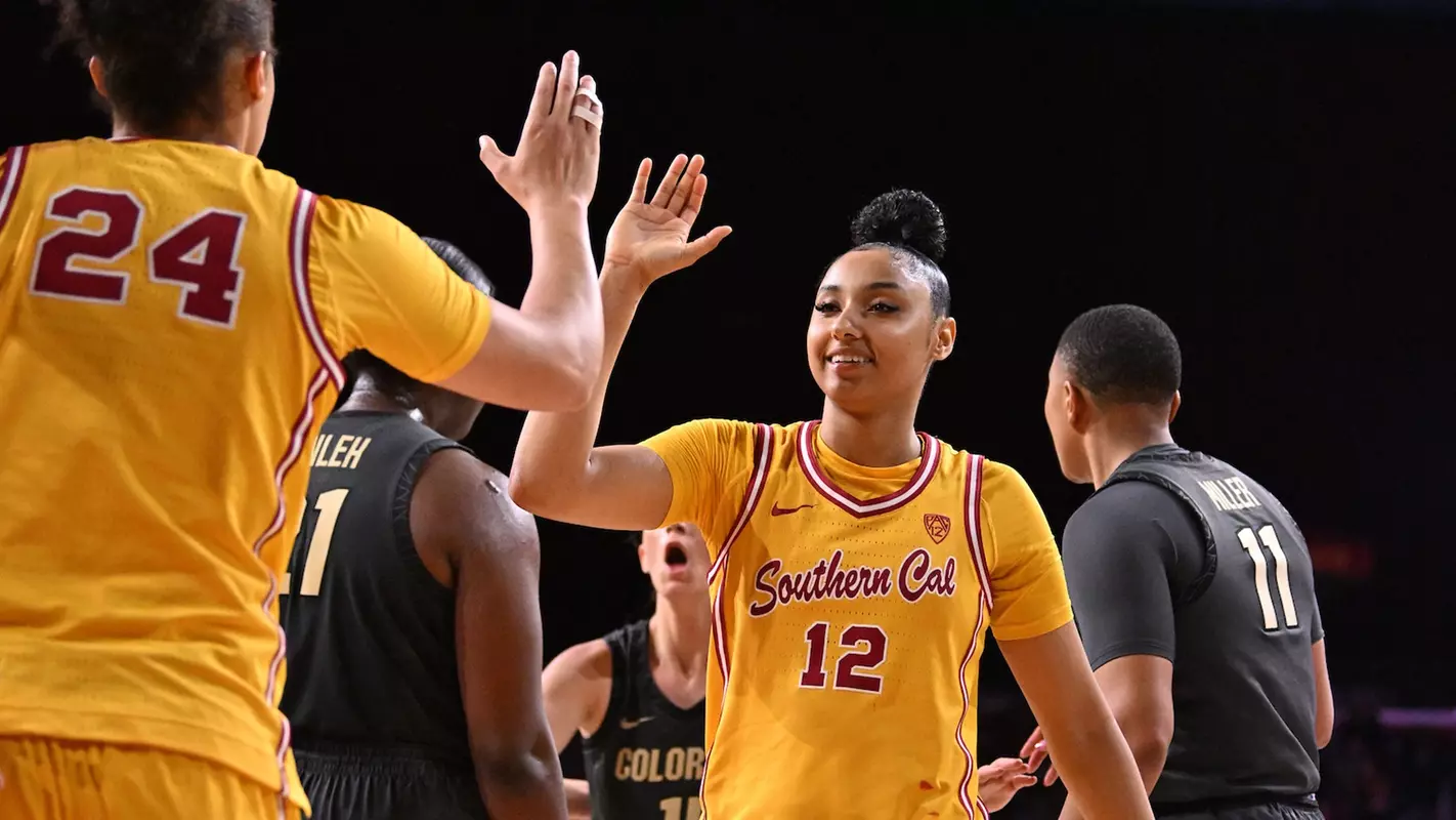 JuJu Watkins and Kaitlyn Davis high five during USC's win over Colorado at Galen Center