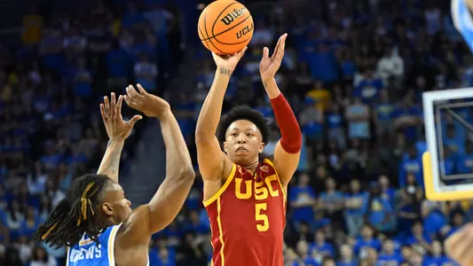 USC Trojans Basketball guard Boogie Ellis shoots over UCLA Bruins