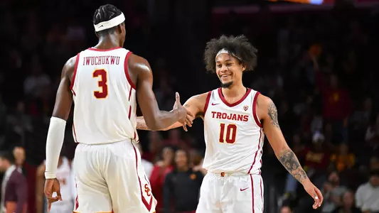USC Trojans Basketball forward DJ Rodman celebrates with Vincent Iwuchukwu