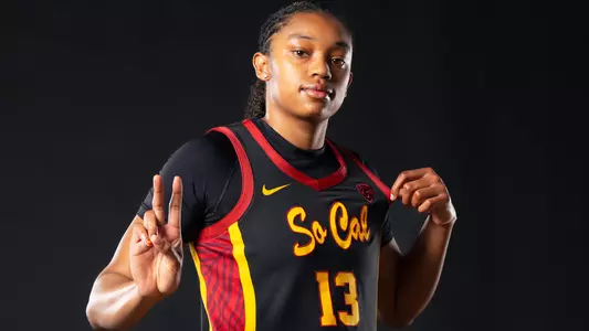 Rayah Marshall poses with a "Fight On" in USC's black SoCal uniform