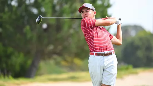 Brando Nishibia follows through on his swing.