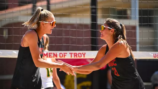 Maddi Kriz and Grace Seits slap hands