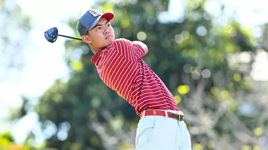 Krando Nishiba follows through on his swing.