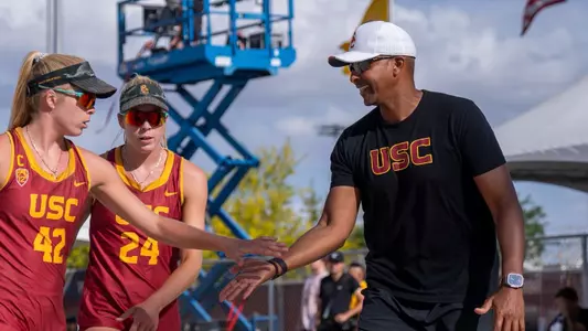 Dain Blanton high fives Audrey and Nicole Nourse