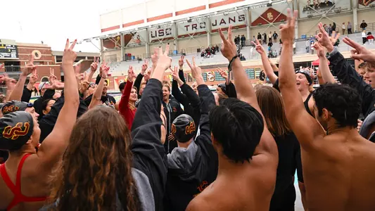 USC swim celebrates after team victory against Stanford
