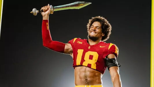 USC Trojans Football linebacker Eric Gentry leads marching band with sword