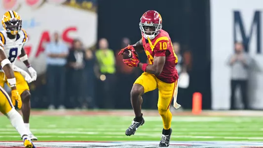 USC Trojans Football wide receiver Kyron Hudson carries ball vs. LSU Tigers