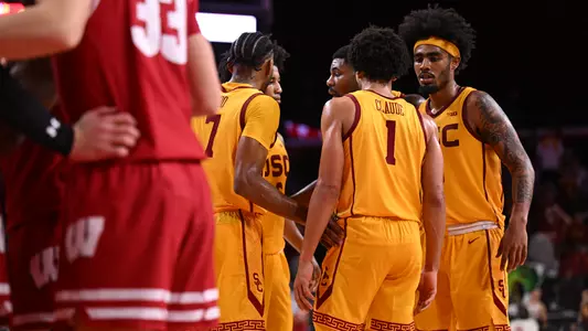 Men's Basketball Team huddles against Wisconsin
