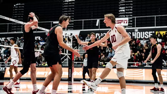 USC men's volleyball players celebrate a point against CSUN