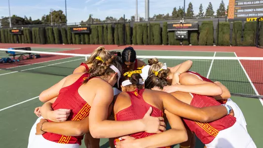 Team huddles in celebration after a match
