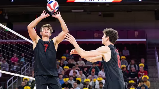 USC men's volleyball junior setter Ryan Sprague puts up a quick-set for freshman middle blocker Parker Tomkinson during a match at Galen Center against Emmanuel.