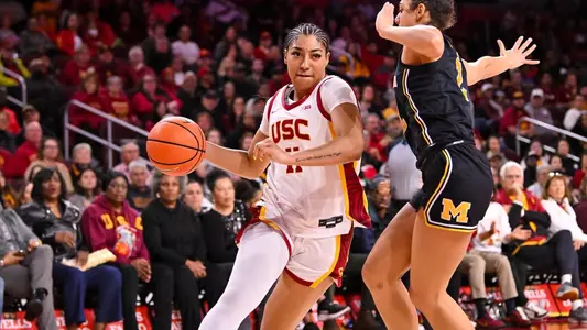 Kennedy Smith dribbles past a defender in USC's win over Michigan at Galen Center