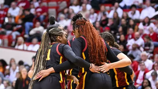 USC players huddle on the court during USC's win at Indiana