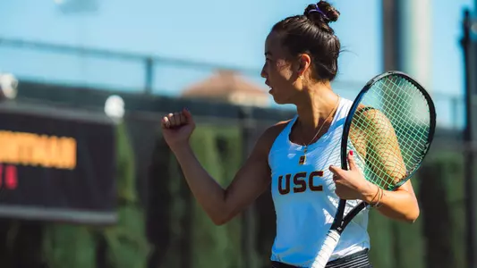 Maia Sung celebrates with a fist pump after a point.